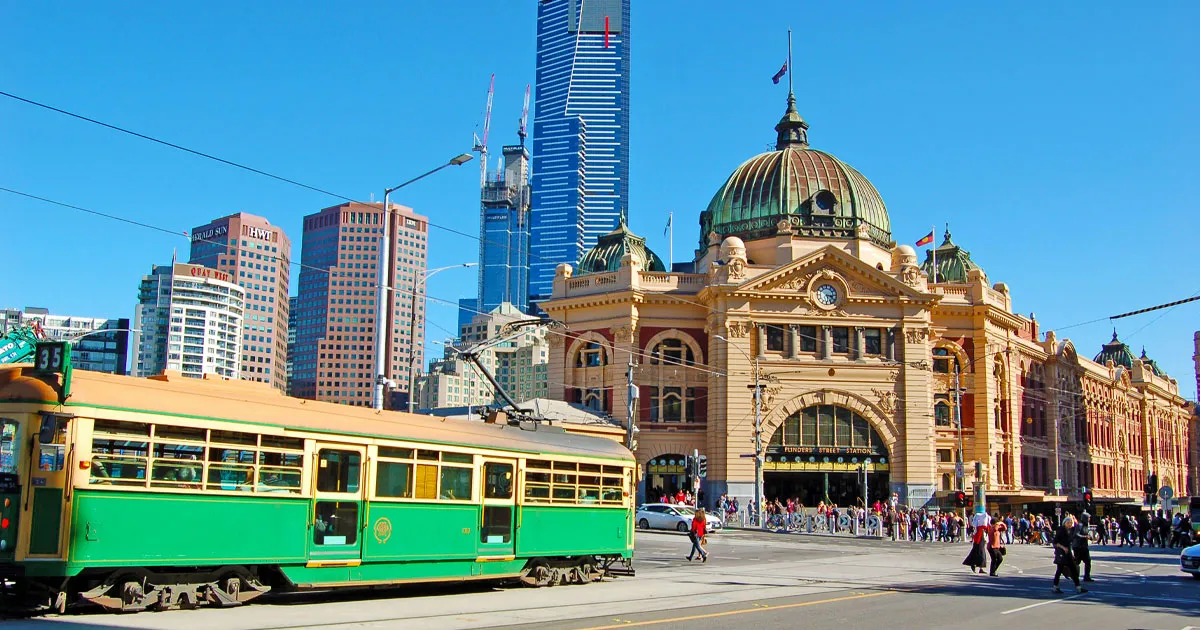 A tram passes in front of Flinders Street Station, Melbourne
