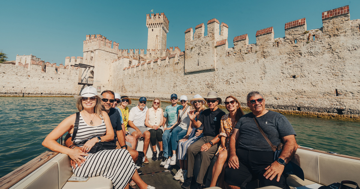 Ultimate Driving Tours guests enjoying a boat tour in Europe.