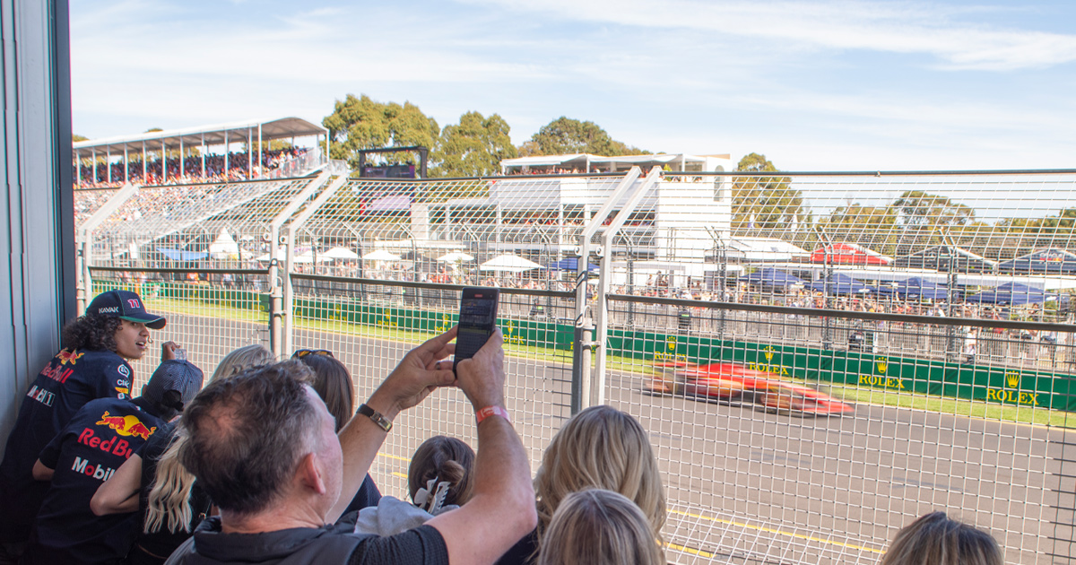 Guests on a luxury tour enjoying trackside F1 views