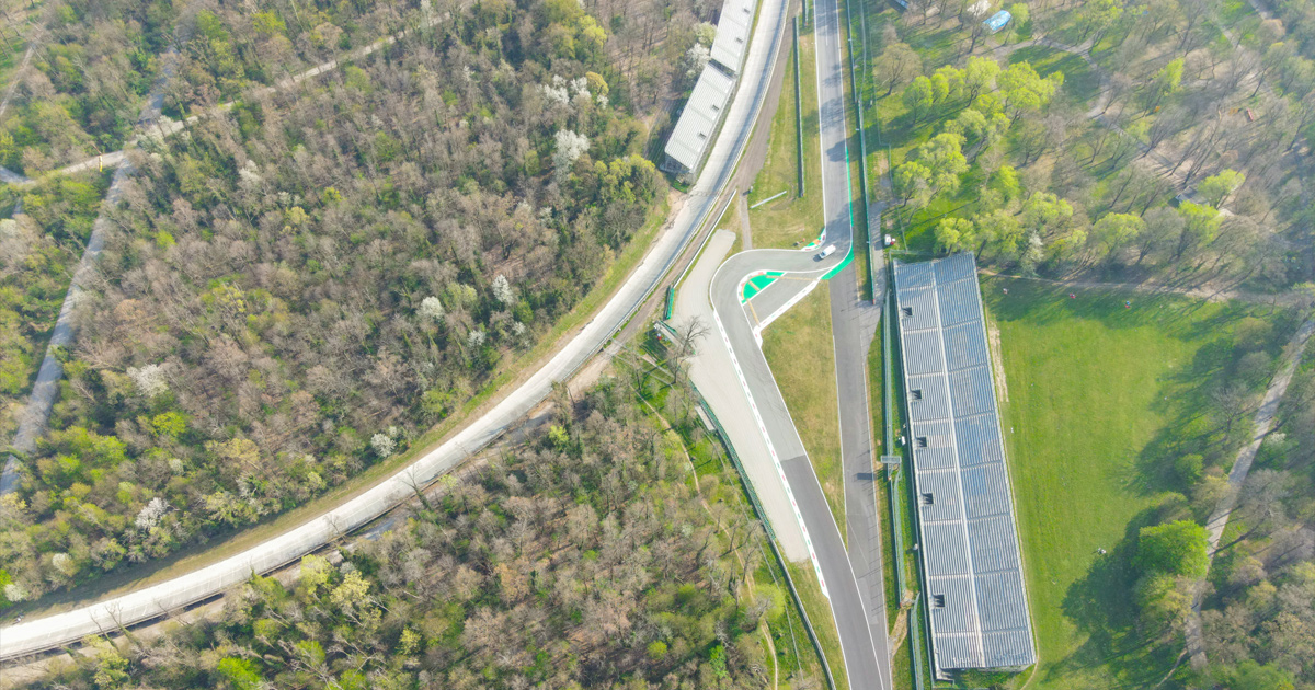 Top down view of a car navigating a tight corner on Monza circuit