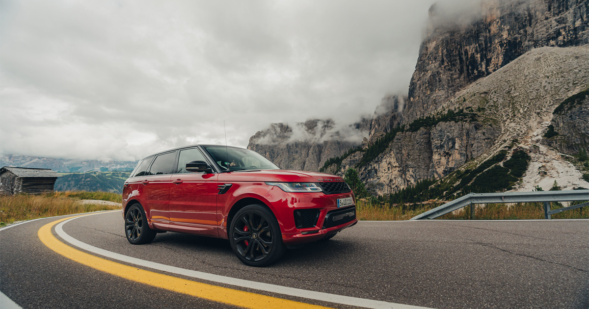 A red Range Rover Sport in action on an Ultimate Driving Tours tour