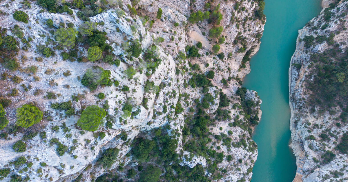 Azure river water running along the canyon floor of the Gorges du Verdon