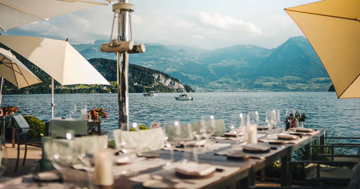 An elegant lunch setting on the banks of Lake Lucerne, Switzerland