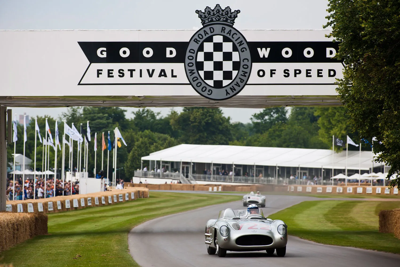 Sterling Moss driving a Mercedes at Goodwood Festival of Speed motorshow