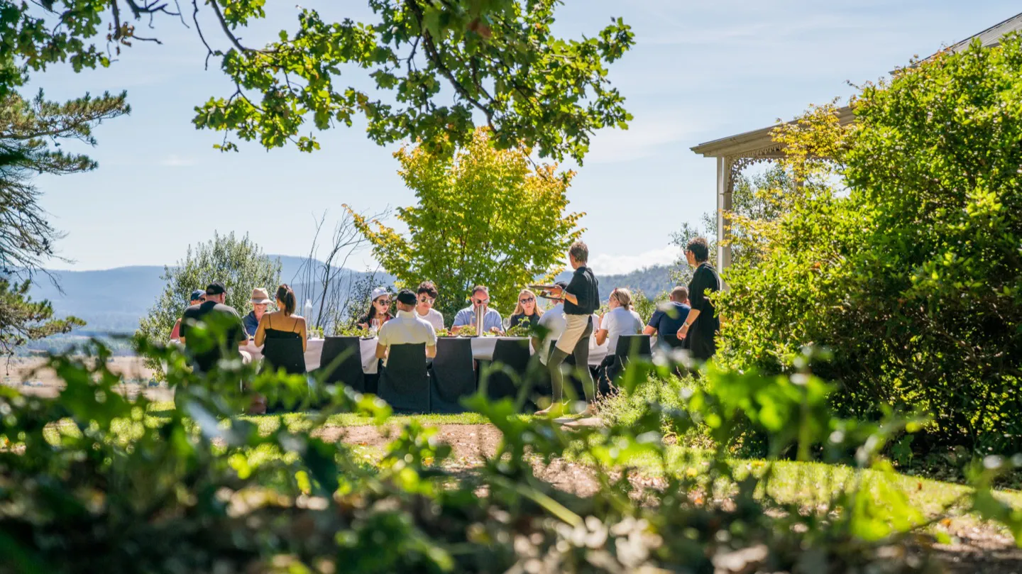 The tour group enjoys a fine dining lunch on our luxury Tasmanian driving tour